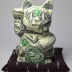 D. Kitty 2014 bank notes on ceramic, silk, polyester filling 13 x 12 x 12 cm
