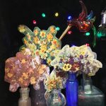 Spring flowers are waning, 2017, 35x22x17, repurposed wooden box, velvet, glass bottles, paper on wood, wind up music box, old glass figurine, repuposed doily, wool, LED lights